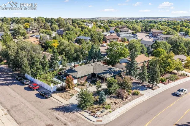 an aerial view of residential houses with outdoor space