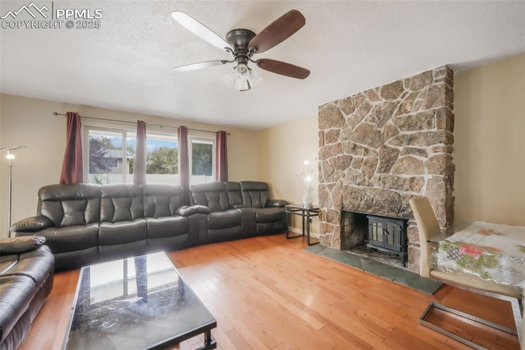 6802 Galley Road Colorado Springs, CO 80915 - Photo 5 of 50 a living room with furniture and a fireplace