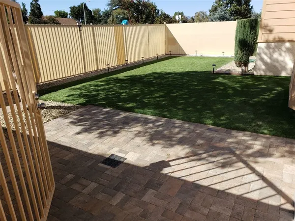 a backyard of a house with lots of green space
