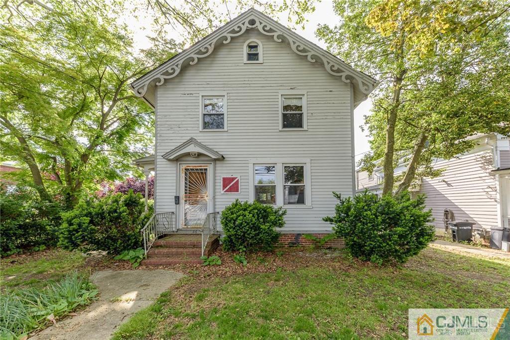 86 Main Street Matawan, NJ 07747 - Photo 1 of 25 a front view of a house with garden