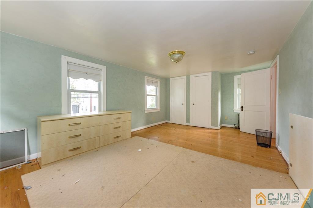 86 Main Street Matawan, NJ 07747 - Photo 18 of 25 a view of an empty room and window cabinet cabinet and windows
