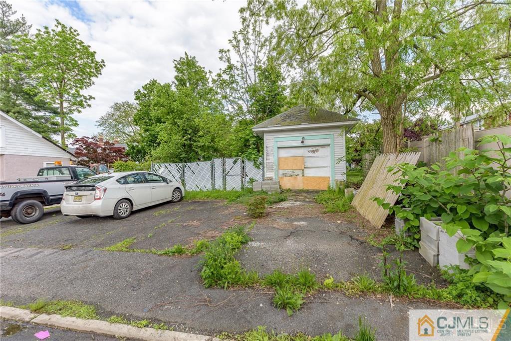 86 Main Street Matawan, NJ 07747 - Photo 25 of 25 a view of a yard with car parked