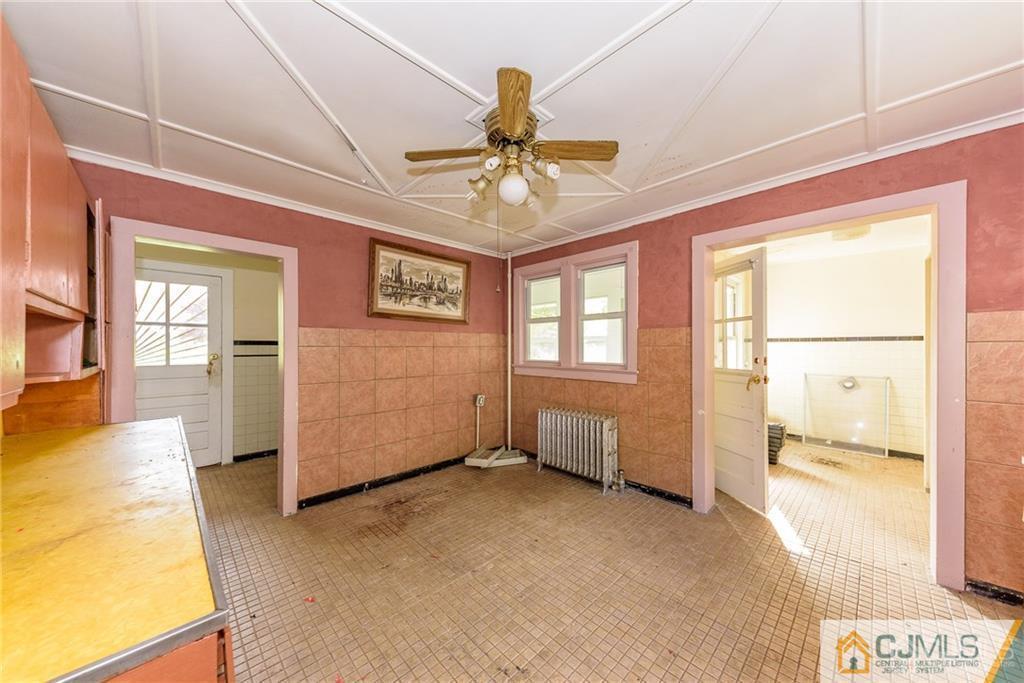86 Main Street Matawan, NJ 07747 - Photo 10 of 25 a view of an empty room with a window