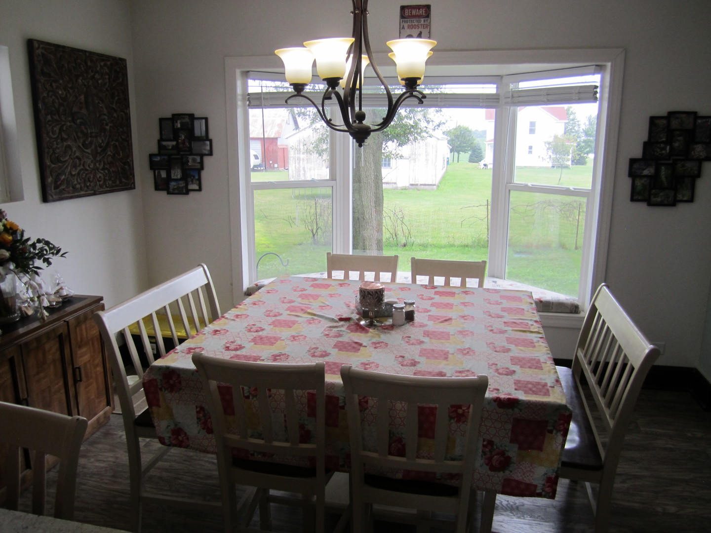 5668 And 5708 State Route Malta, IL 60150 - Photo 13 of 37 a view of a dining room with furniture a chandelier and large windows
