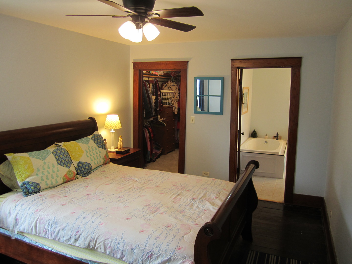5668 And 5708 State Route Malta, IL 60150 - Photo 17 of 37 a bedroom with a bed and a chandelier