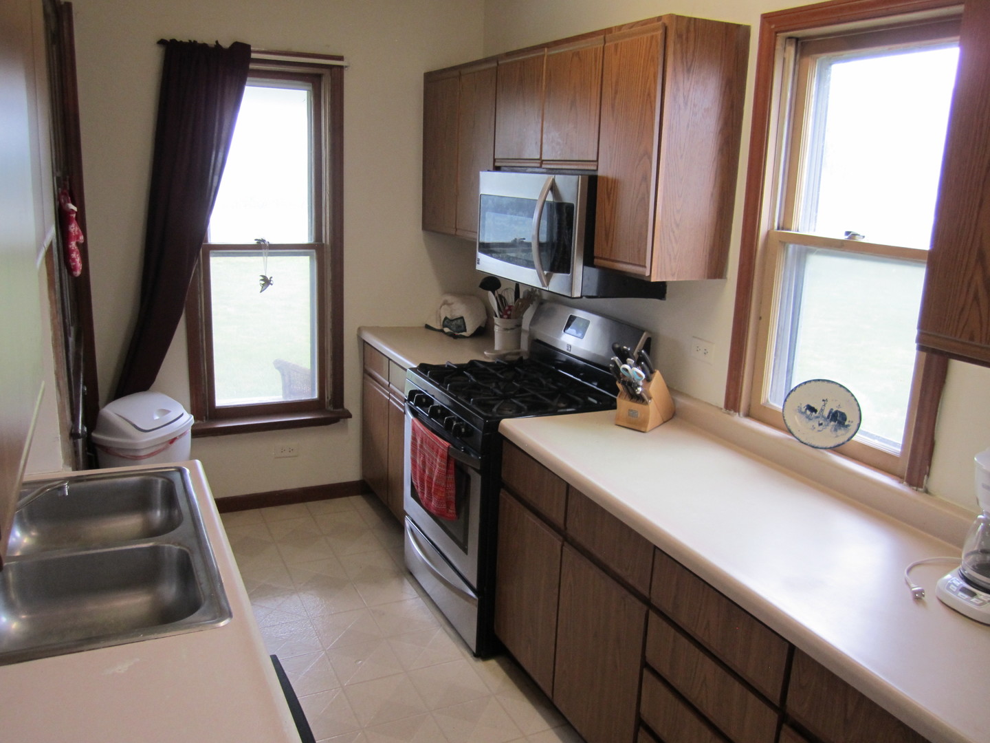 5668 And 5708 State Route Malta, IL 60150 - Photo 27 of 37 a kitchen with a sink appliances and a window
