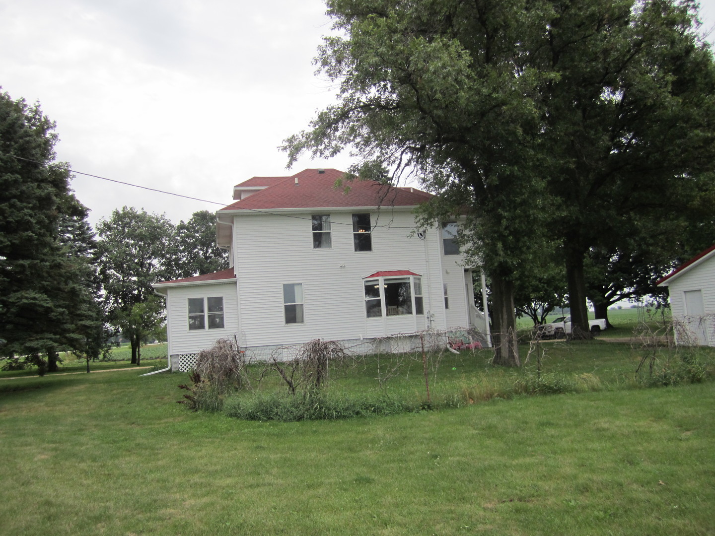 5668 And 5708 State Route Malta, IL 60150 - Photo 7 of 37 a view of a house with a yard