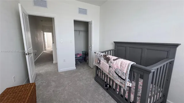 a view of a hallway with a wooden door