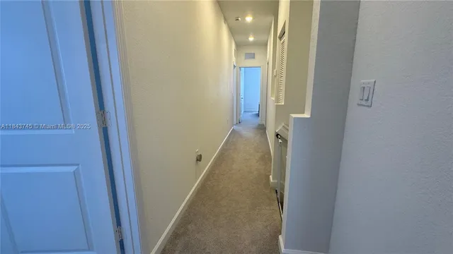 a bathroom with a toilet and a shower curtain