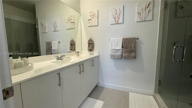 a bathroom with a sink and mirror