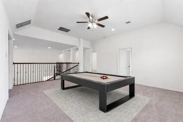 a bathroom with a sink toilet vanity and shower