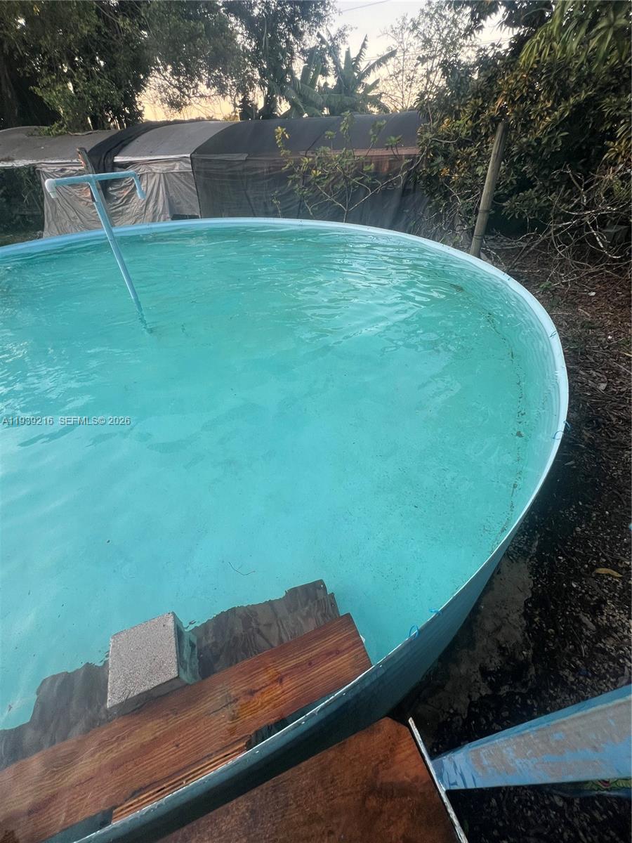 17540 Southwest 254th Street Homestead, FL 33031 - Photo 29 of 85 a view of a backyard with a chair