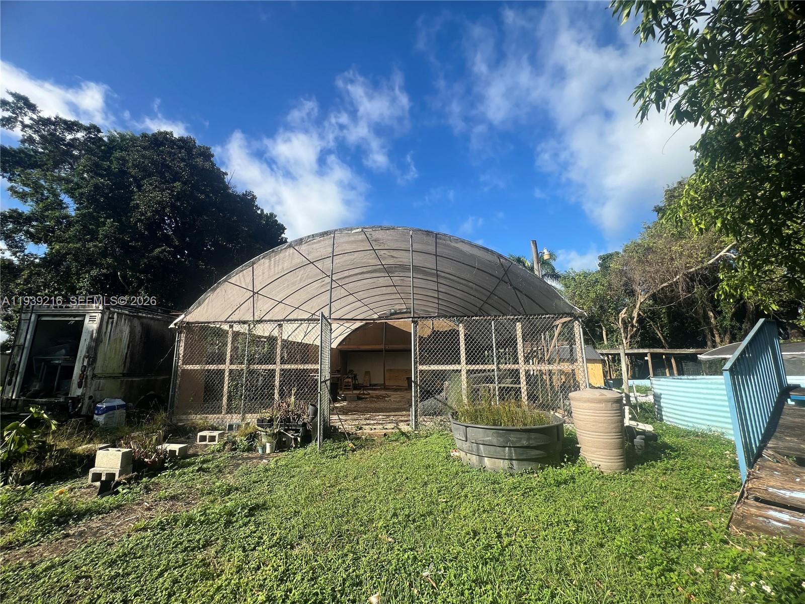 17540 Southwest 254th Street Homestead, FL 33031 - Photo 50 of 85 a view of a house with backyard
