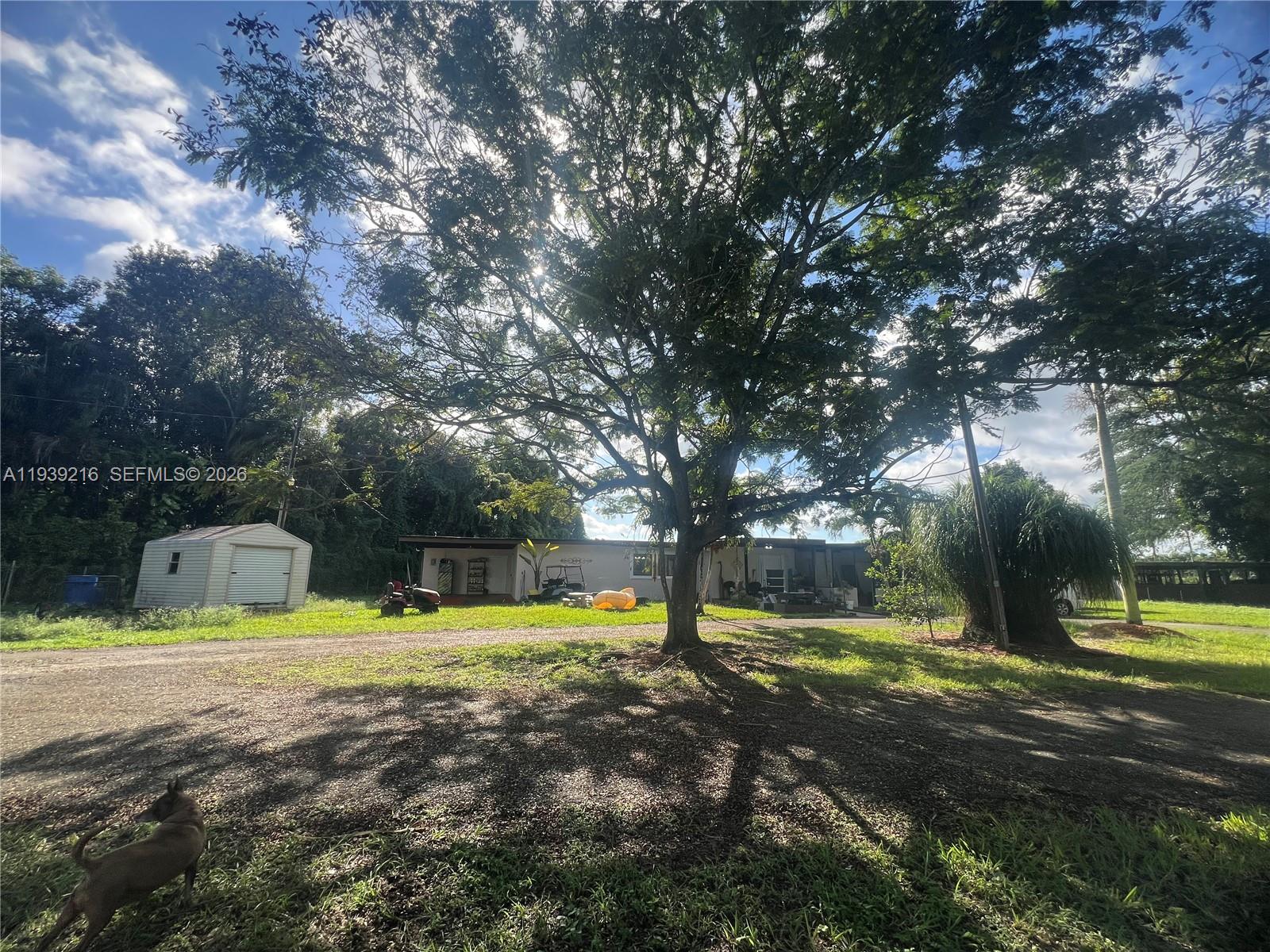 17540 Southwest 254th Street Homestead, FL 33031 - Photo 54 of 85 a view of a swimming pool with an outdoor space