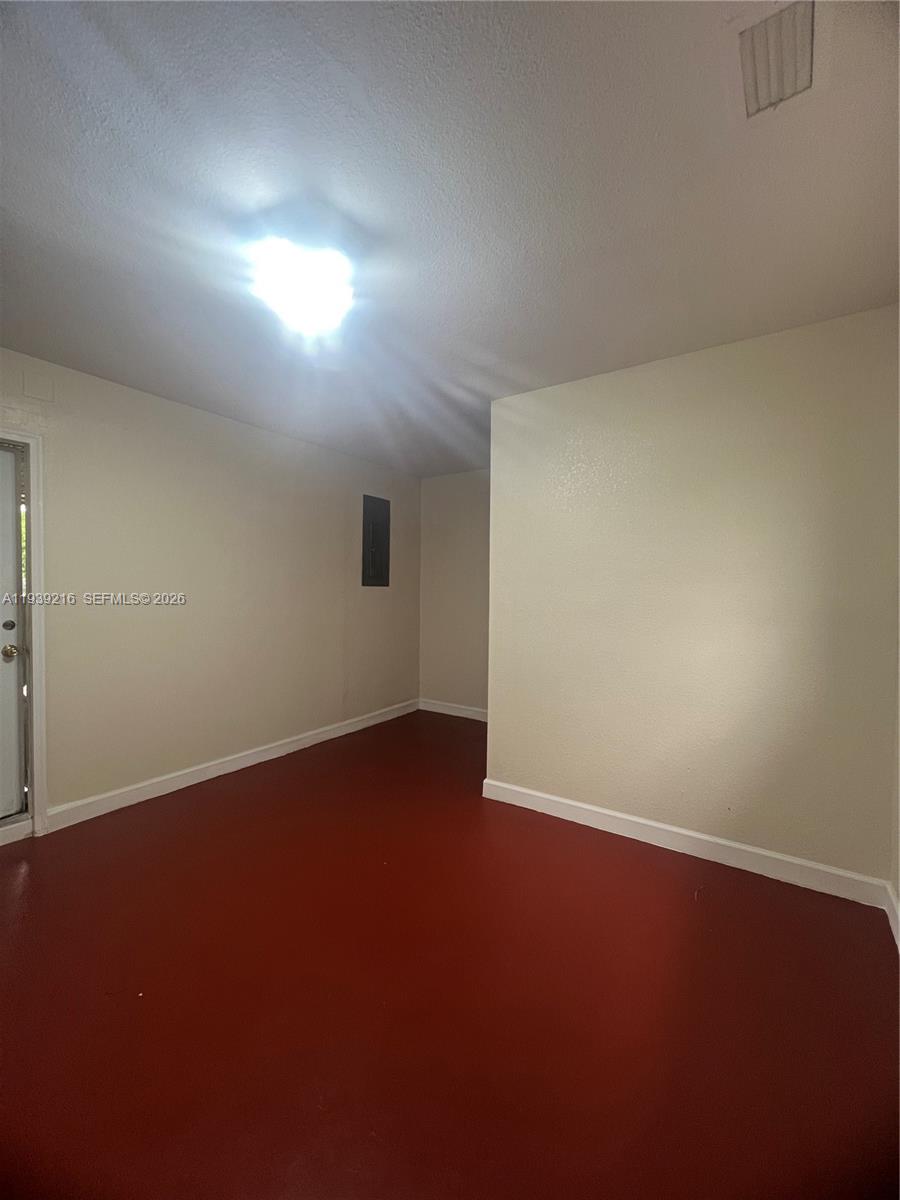 17540 Southwest 254th Street Homestead, FL 33031 - Photo 74 of 85 an empty room with a empty space and window