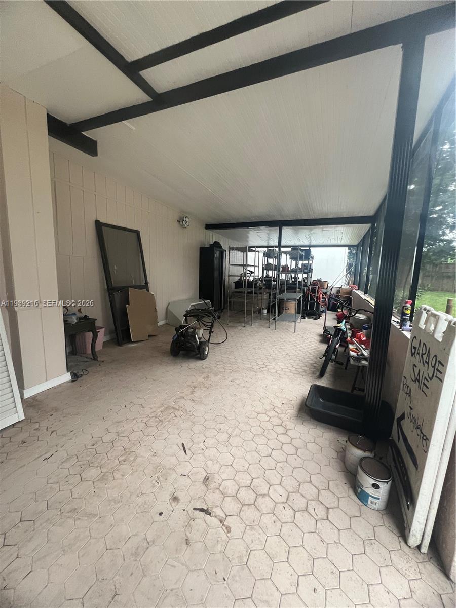 17540 Southwest 254th Street Homestead, FL 33031 - Photo 75 of 85 a room with gym equipment and a large window