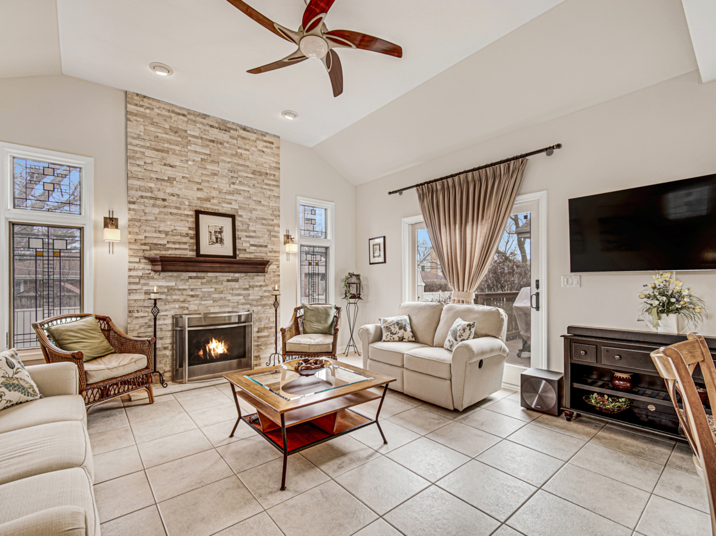 631 Riverside Drive Park Ridge, IL 60068 - Photo 11 of 31 a living room with furniture a flat screen tv and a fireplace