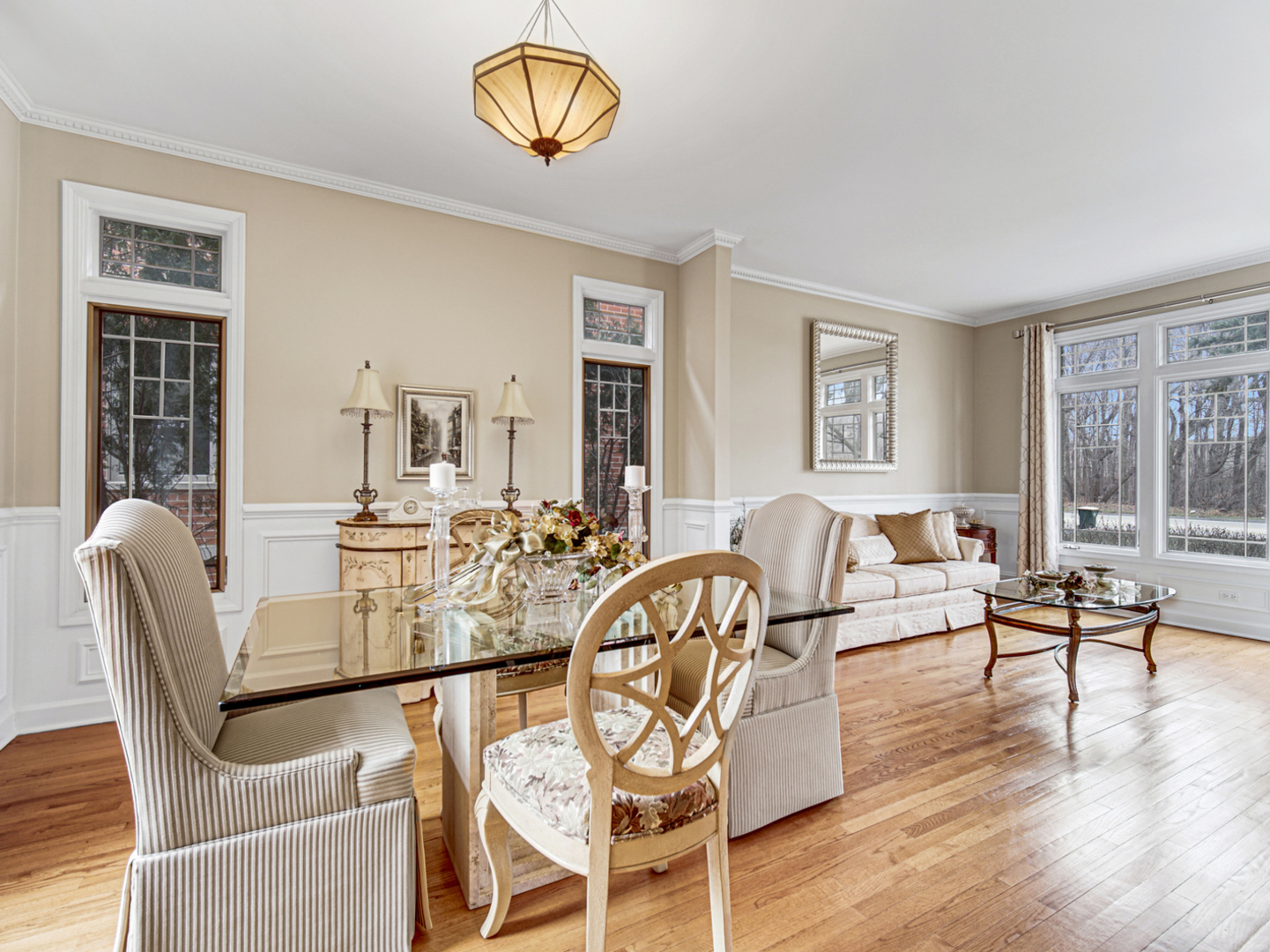 631 Riverside Drive Park Ridge, IL 60068 - Photo 5 of 31 a dining room with furniture a chandelier and wooden floor
