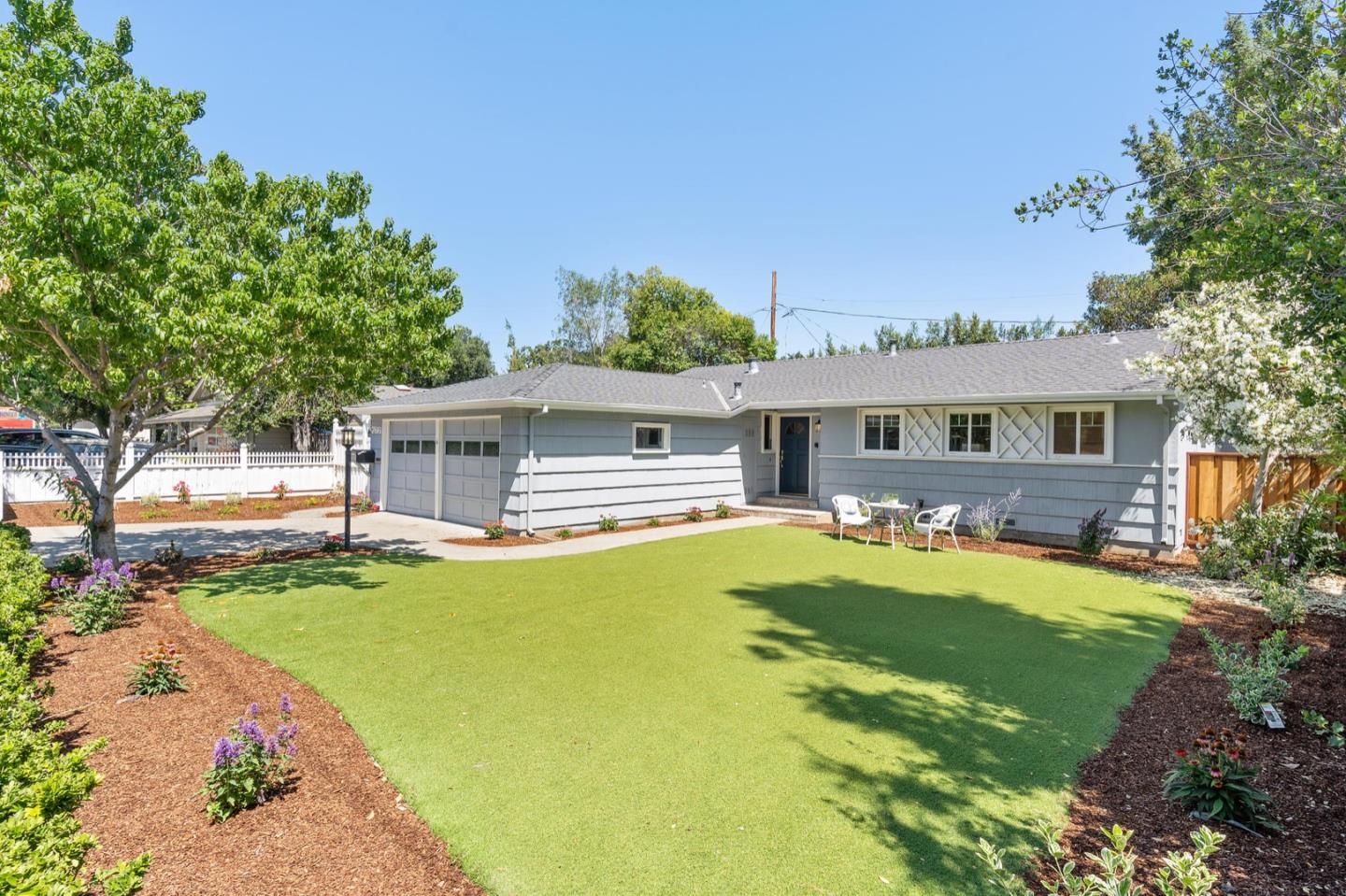 a view of house with swimming pool yard and outdoor seating
