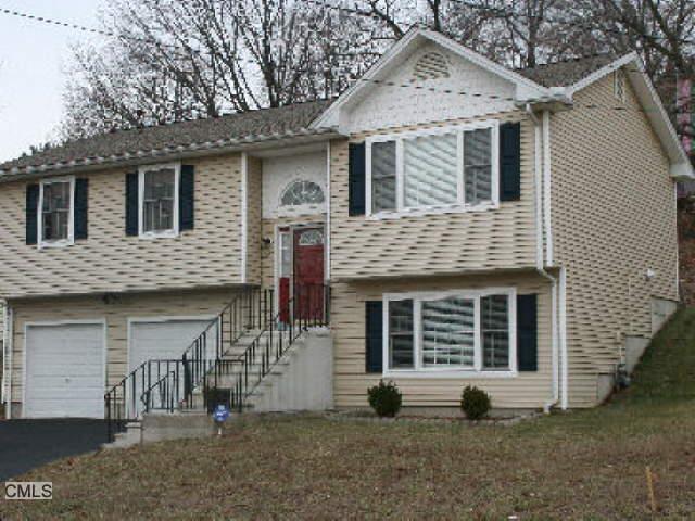 815 Seltsam Road Bridgeport, CT 06606 - Photo 1 of 1 a view of a house with a yard