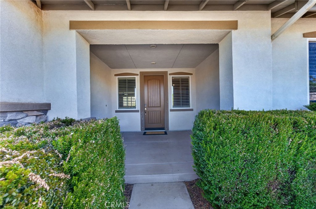 23347 Crystal Way Wildomar, CA 92595 - Photo 102 of 109 a front view of a house with garden