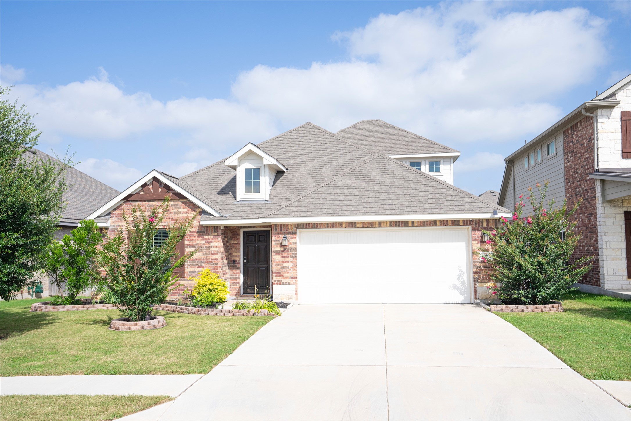 20916 Carries Ranch Road Pflugerville, TX 78660 - Photo 2 of 40 a front view of a house with a yard