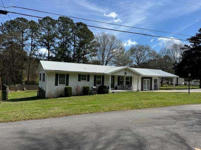 45 Plainview Street Rockmart, GA 30153 - Photo 2 of 24 a front view of a house with a garden