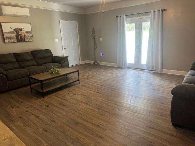 45 Plainview Street Rockmart, GA 30153 - Photo 9 of 24 a living room with furniture and a wooden floor