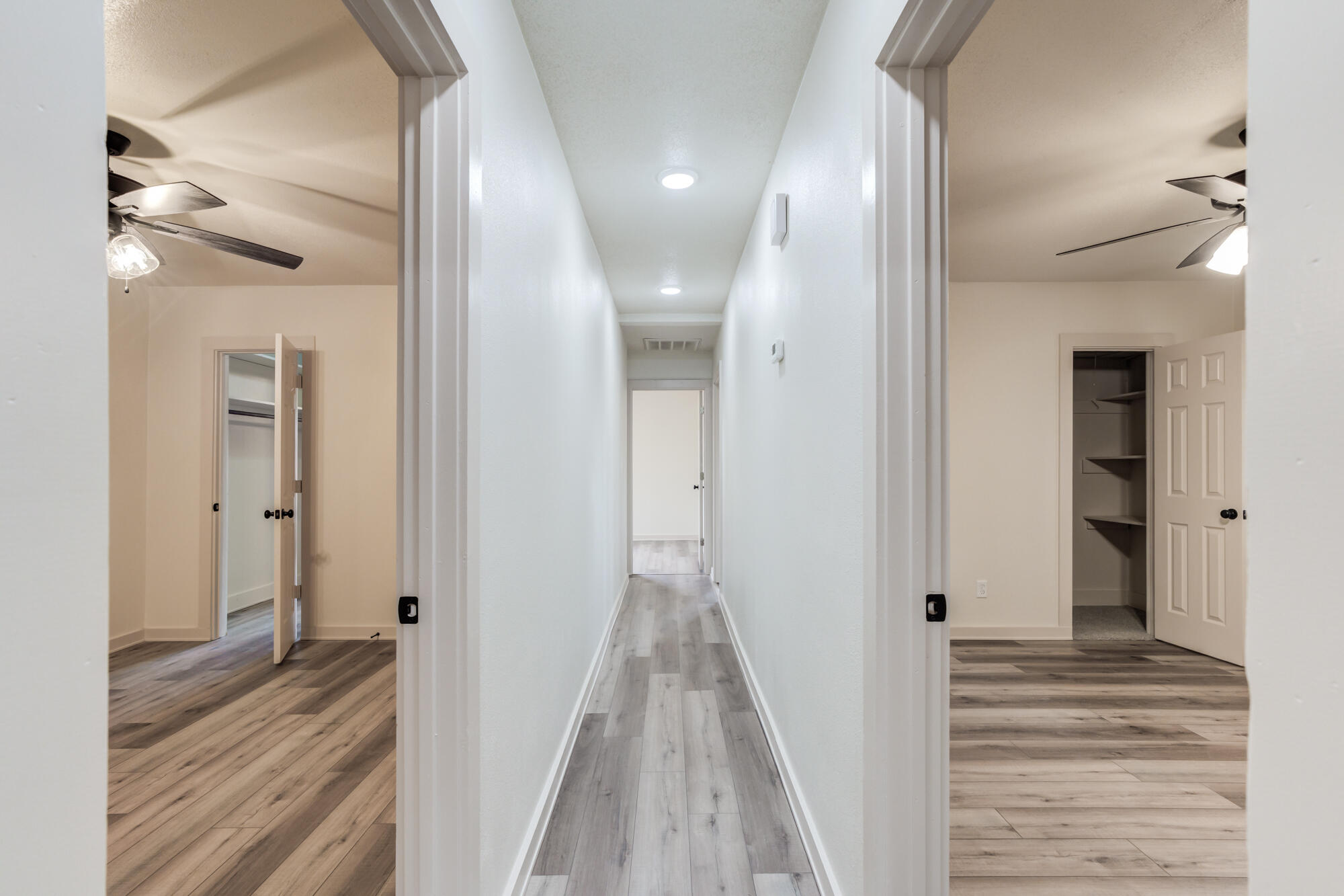 315 West Garza Street Slaton, TX 79364 - Photo 21 of 35 a view of a hallway with wooden floor and staircase