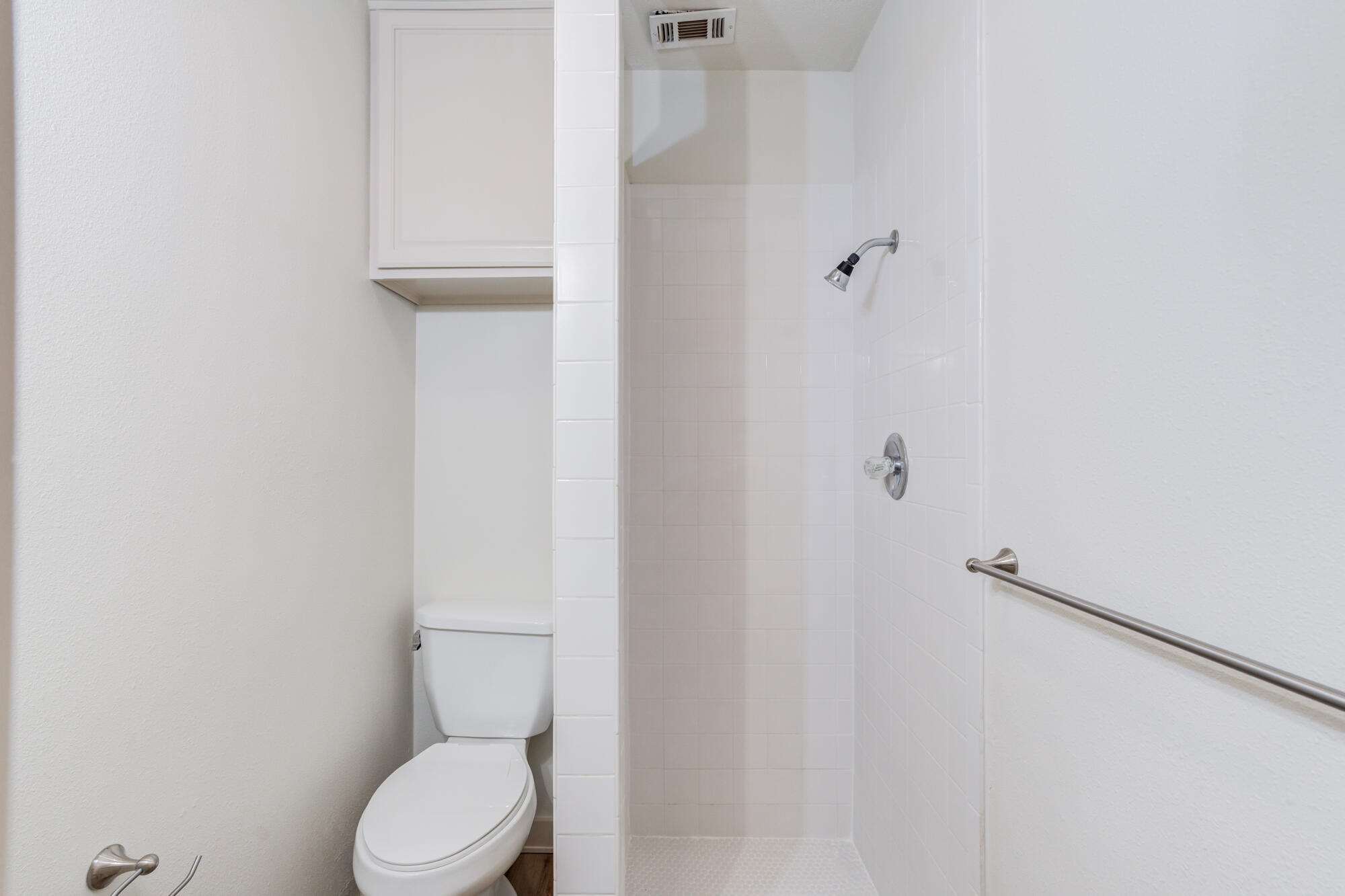 315 West Garza Street Slaton, TX 79364 - Photo 24 of 35 a white toilet sitting next to a shower