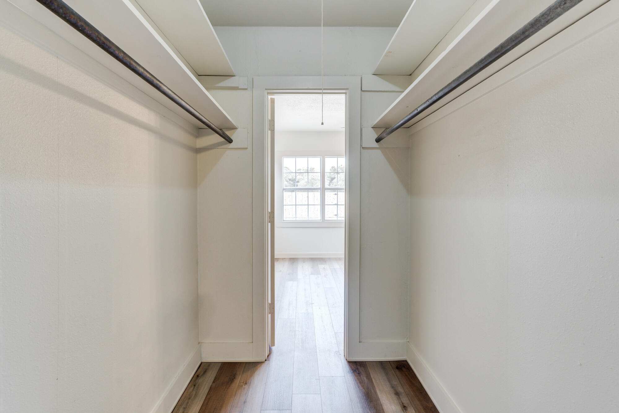 315 West Garza Street Slaton, TX 79364 - Photo 26 of 35 a view of hallway with wooden floor