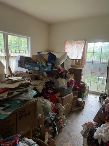 a room with gym equipment and a large window