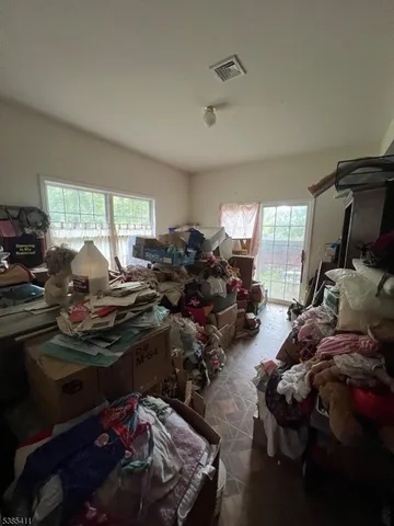 a room with gym equipment and window