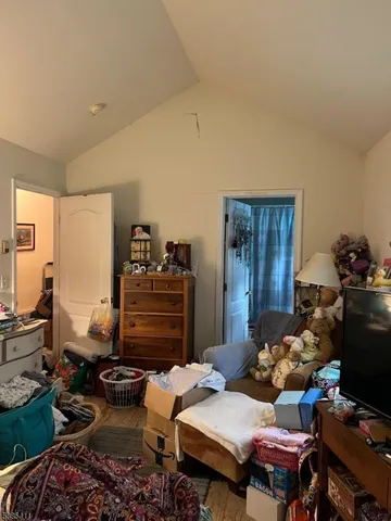 a bedroom with furniture toys and wooden floor