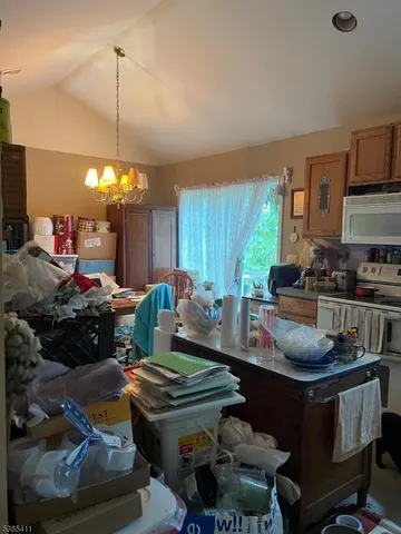 a kitchen with a stove and a refrigerator