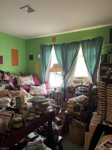 a room with gym equipment and a large window