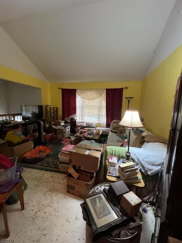 a living room with furniture a window and a table