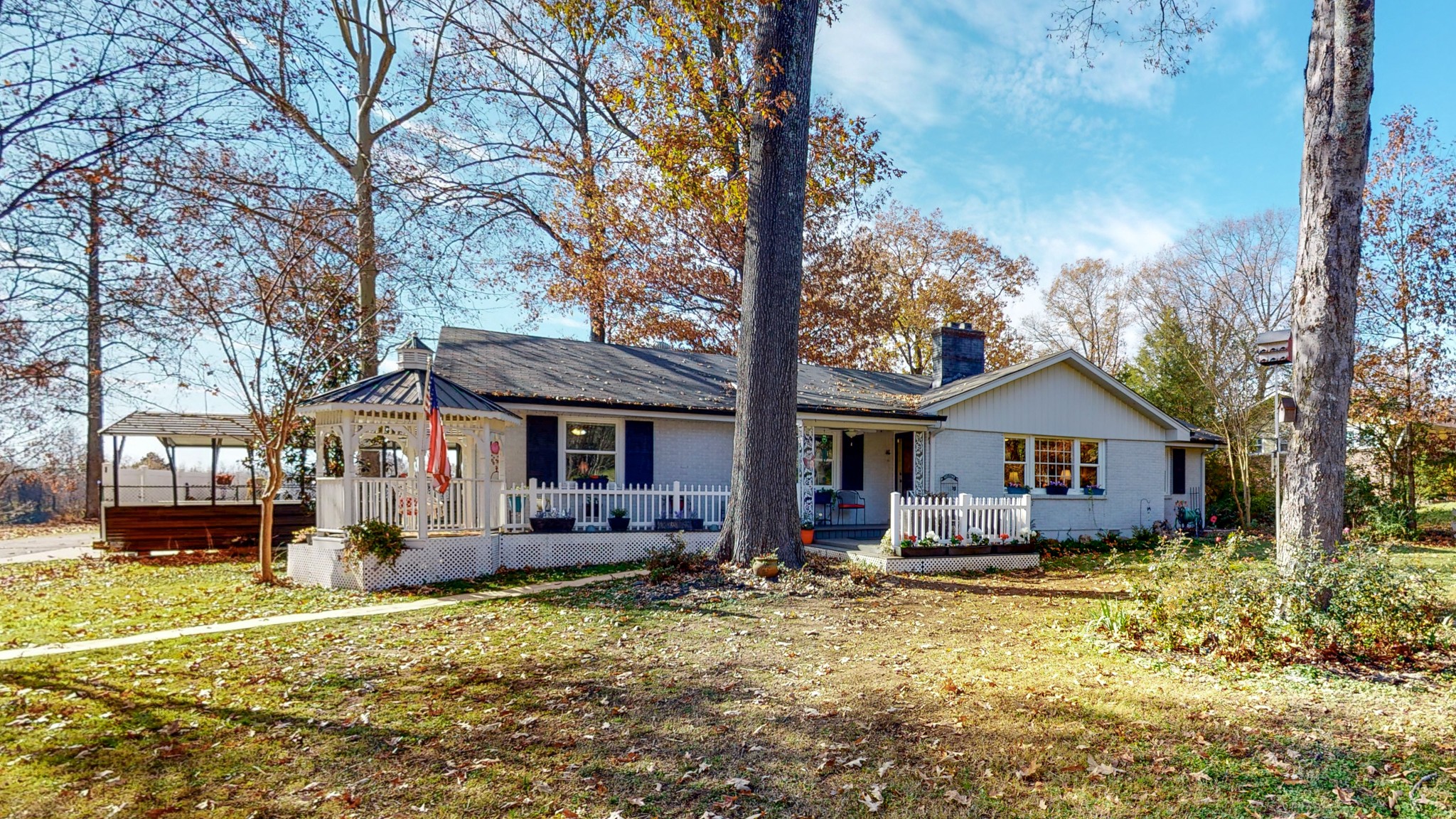 1108 Berwick Trail Madison, TN 37115 - Photo 3 of 54 front view of a house with a yard outdoor seating and covered with trees