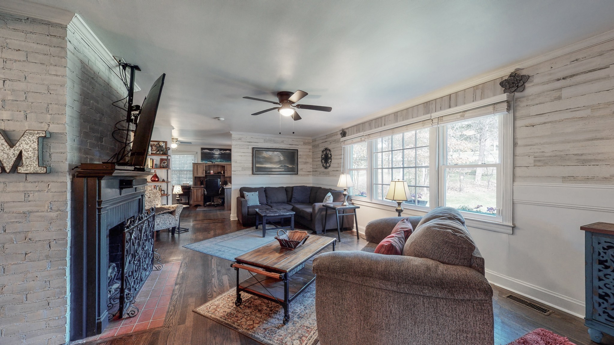 1108 Berwick Trail Madison, TN 37115 - Photo 9 of 54 a living room with furniture a fireplace and a large window
