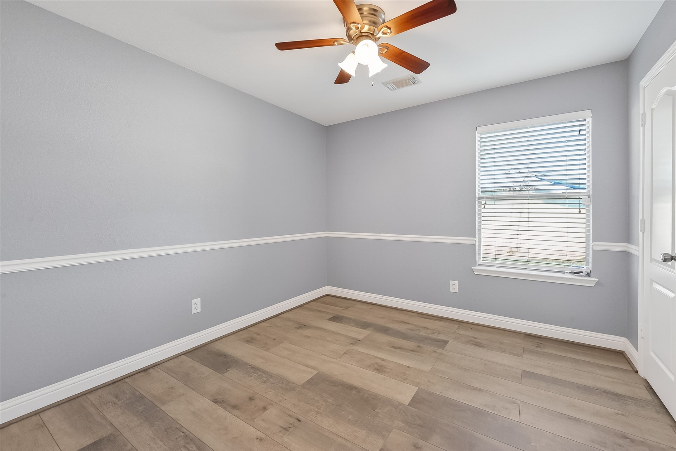 29603 Golden Vines Lane Spring, TX 77386 - Photo 15 of 23 wooden floor in an empty room with a window