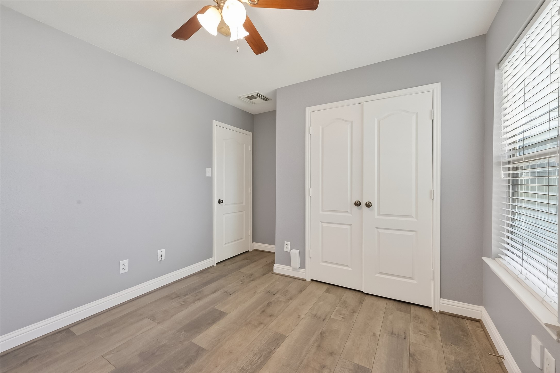 29603 Golden Vines Lane Spring, TX 77386 - Photo 20 of 23 wooden floor in an empty room with a window