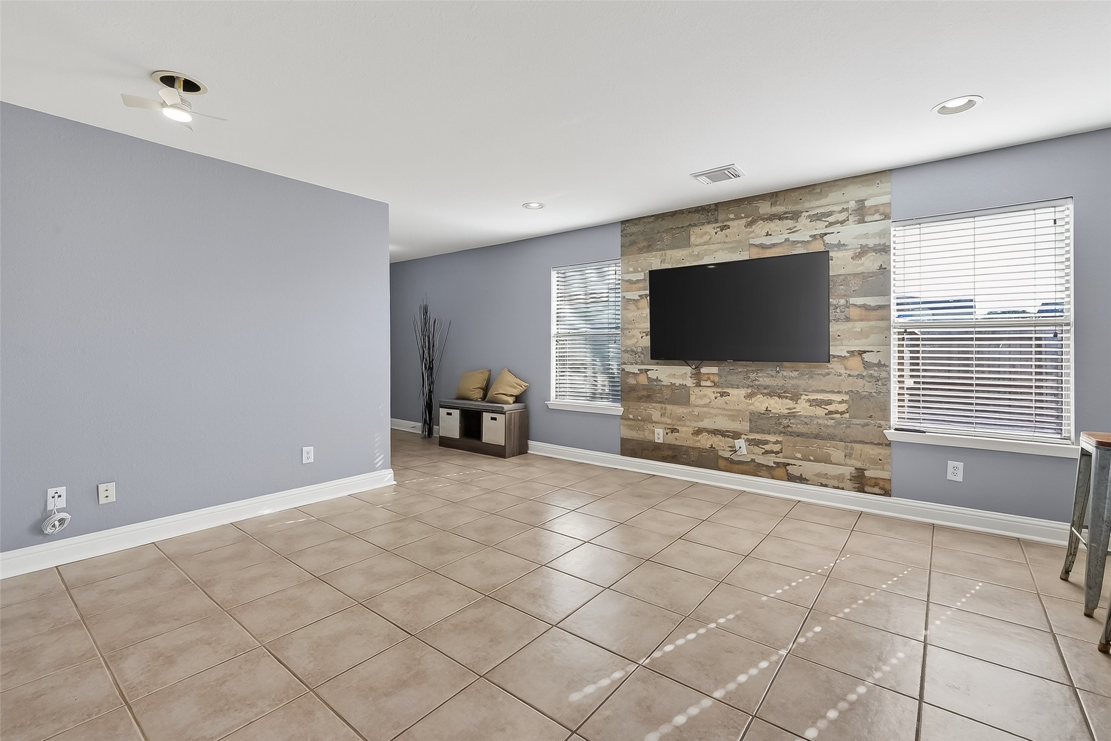 29603 Golden Vines Lane Spring, TX 77386 - Photo 6 of 23 a living room with furniture and a flat screen tv