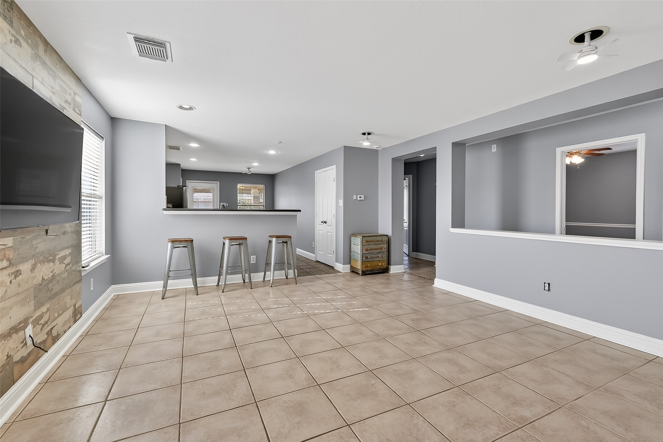 29603 Golden Vines Lane Spring, TX 77386 - Photo 7 of 23 a view of an empty room with kitchen and window