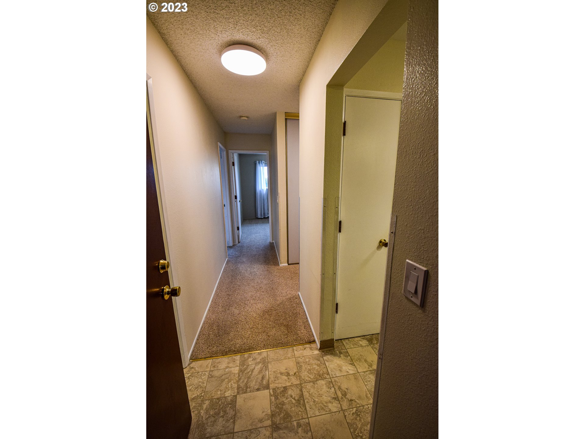 950 Evergreen Road, Unit 312 Woodburn, OR 97071 - Photo 2 of 16 a view of a bathroom from a hallway