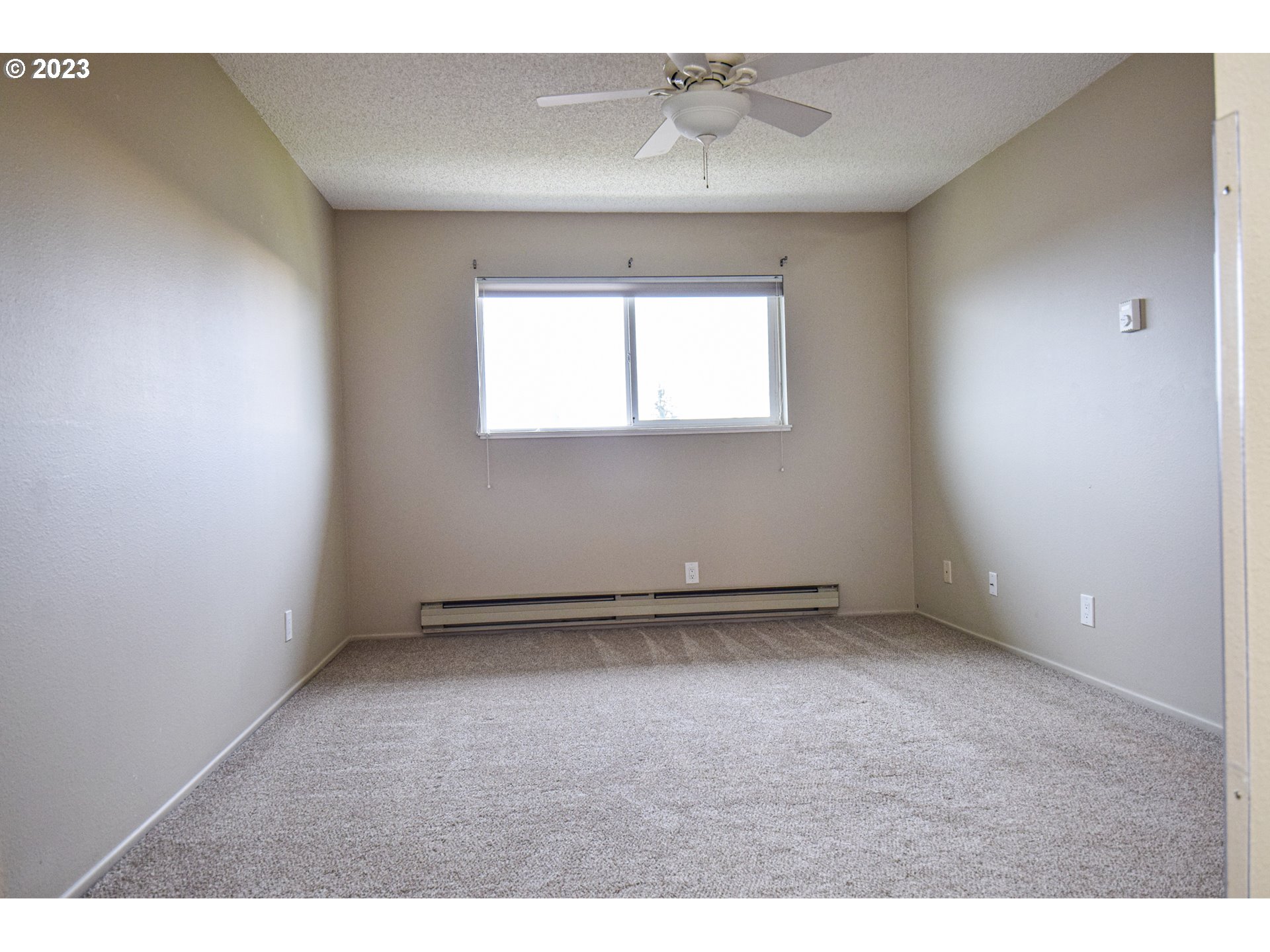 950 Evergreen Road, Unit 312 Woodburn, OR 97071 - Photo 9 of 16 a view of an empty room with a window