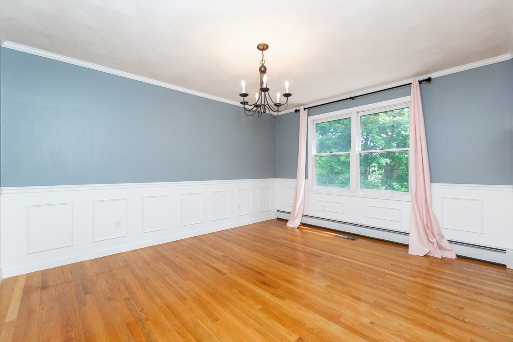 63 Bow Street Saugus, MA 01906 - Photo 6 of 42 wooden floor in an empty room with a window