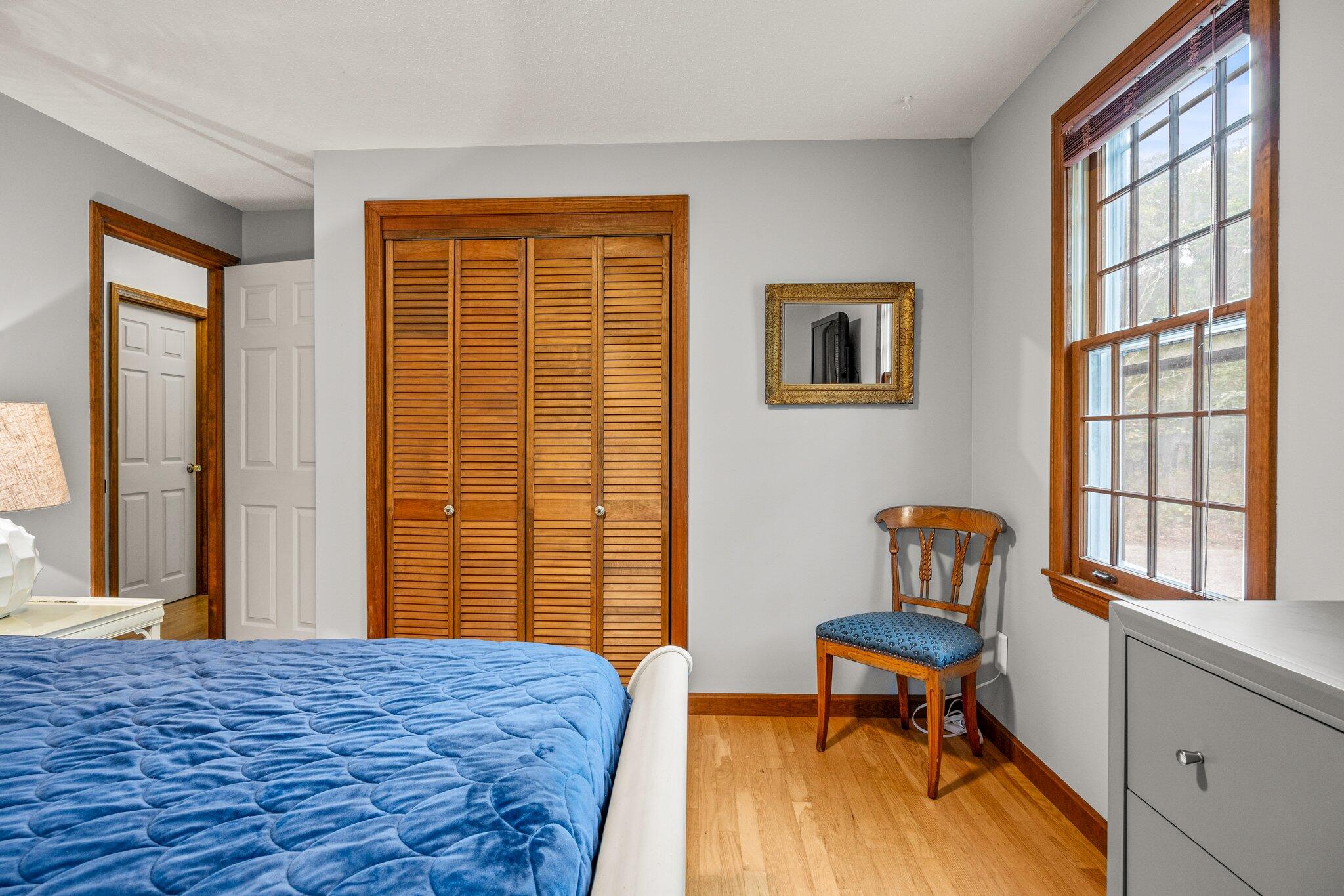 243 Commons Way Brewster, MA 02631 - Photo 13 of 32 a bedroom with a bed and a window