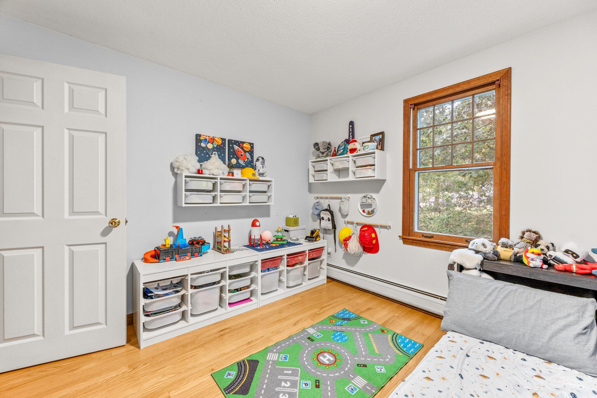 243 Commons Way Brewster, MA 02631 - Photo 15 of 32 a play room with furniture toys and a window