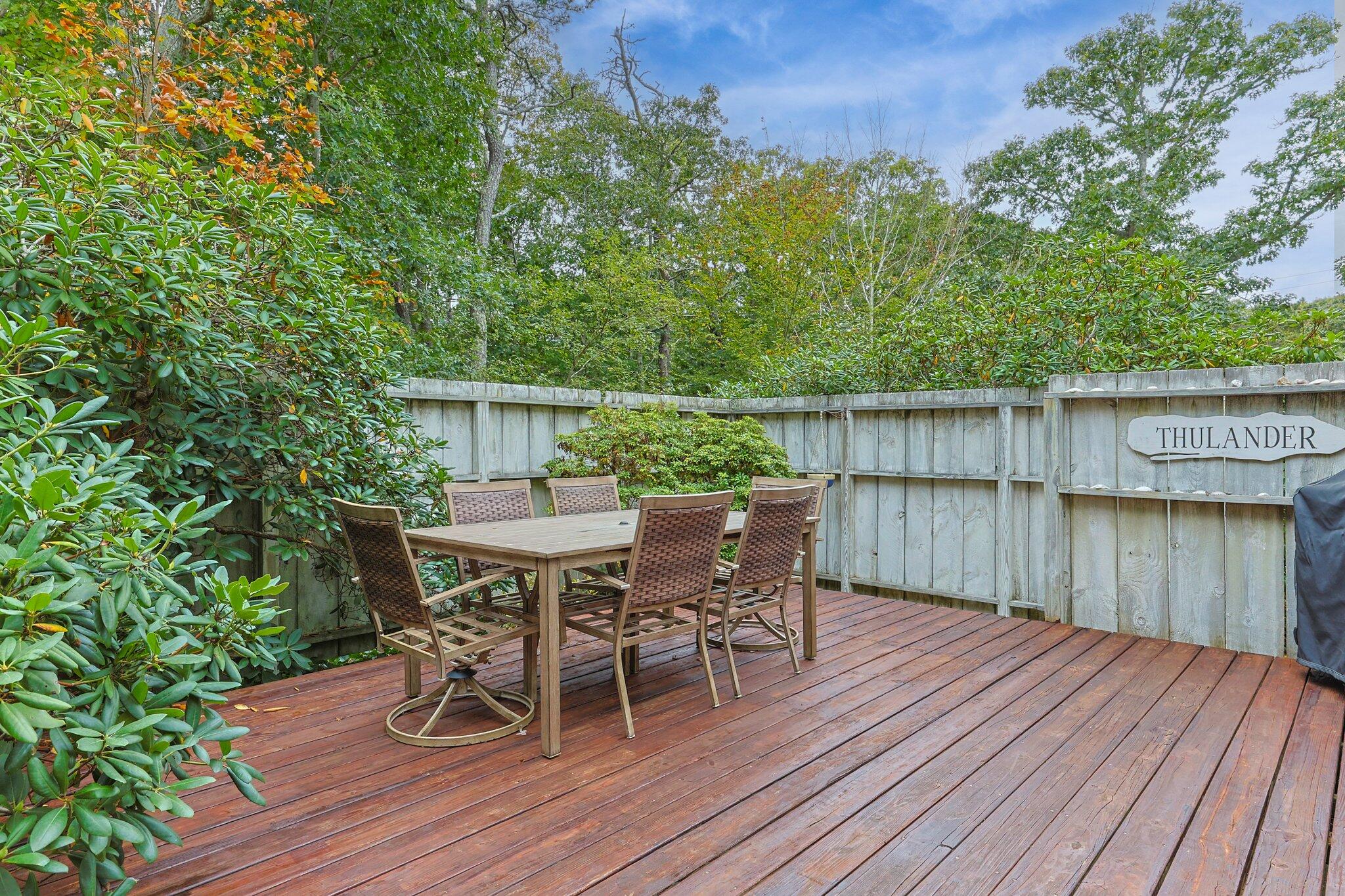 243 Commons Way Brewster, MA 02631 - Photo 25 of 32 a balcony with wooden floor table and chairs