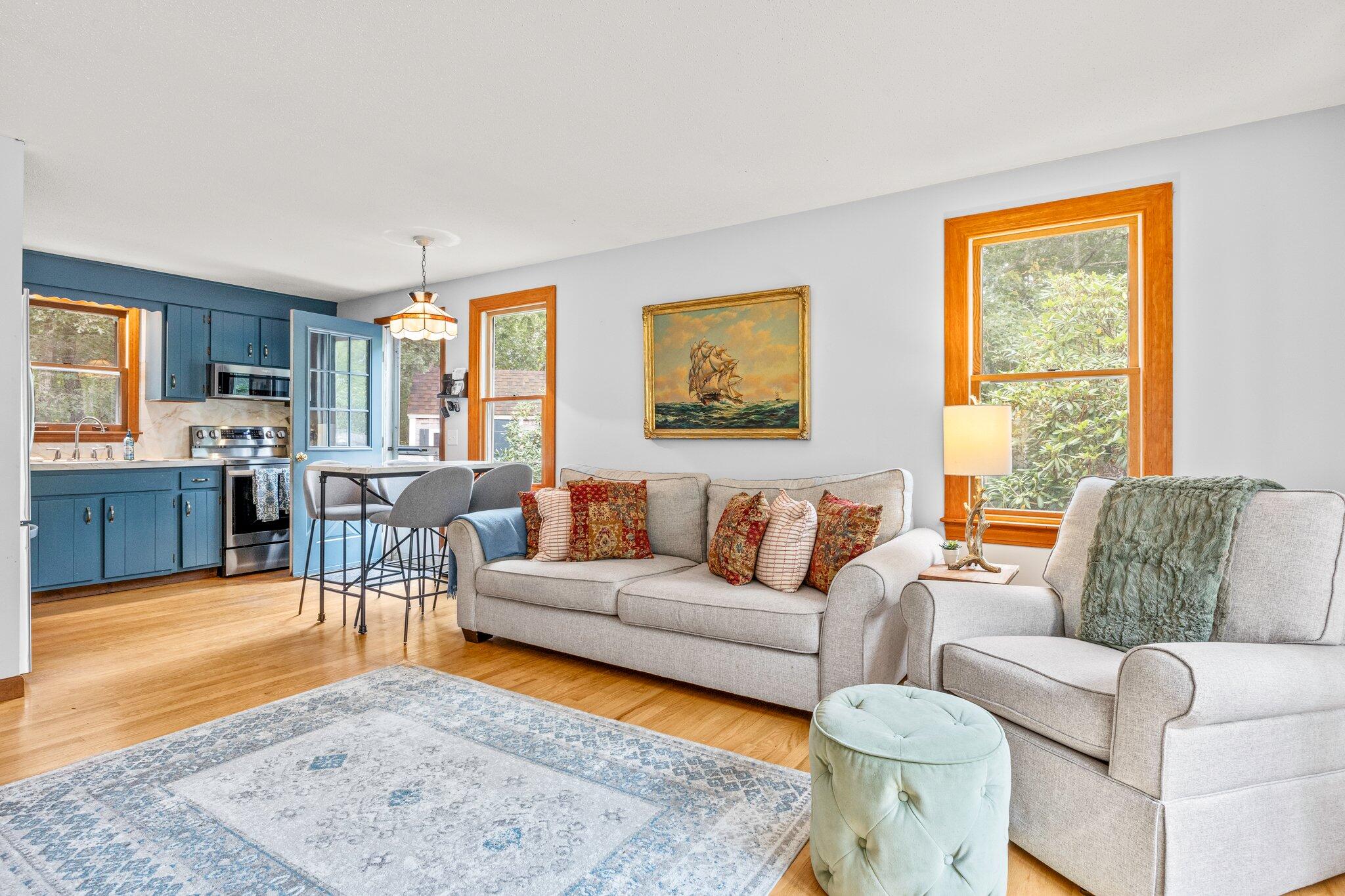 243 Commons Way Brewster, MA 02631 - Photo 5 of 32 a living room with furniture and a large window